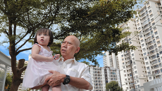 Portrait of Asian senior men with granddaughter