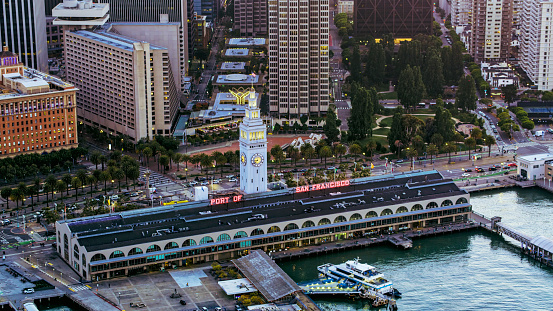 Aerial view on a sunny day of Mission Bay area with At & T Park, South Beach Marina and a view of the San Francisco skyline including iconic landmarks.