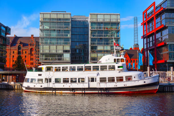 View of HafenCity quarter in Hamburg, Germany . Boat at water canal