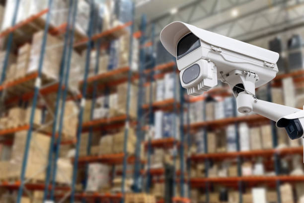 istock CCTV Camera Operating inside warehouse or factory. Copy space. 1571499075