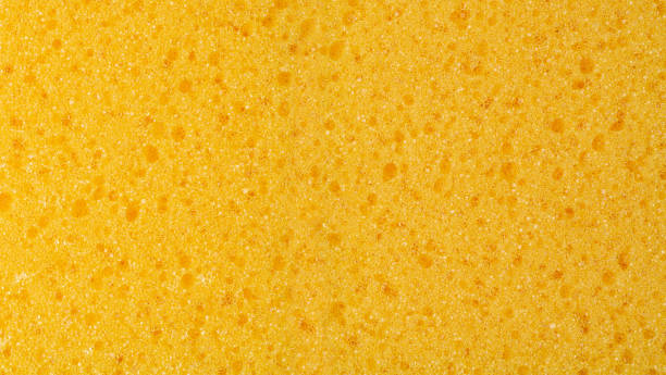 istock Sponge Sift Side Texture Background, Yellow Synthetic Material 1571513605