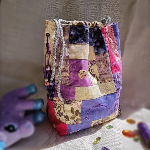 istock Patchwork art, drawstring bag, handmade textile design, sustainable art, unicorn toy 1571528133