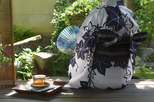 Woman & A Glass of Tea at the Japanese Styled Balcony