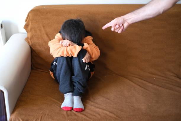 Little boy pissing off his father