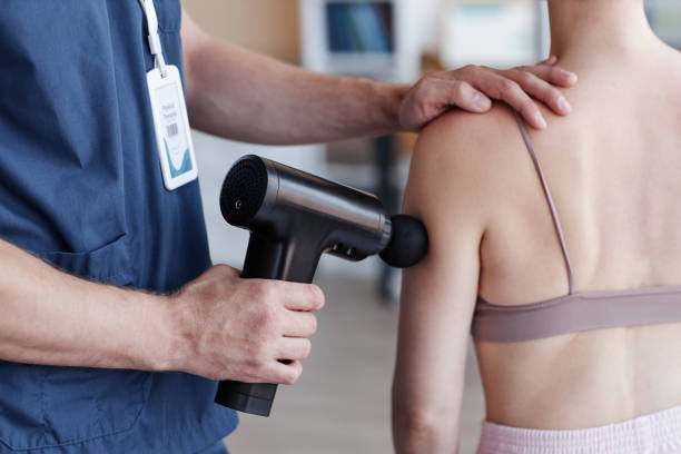 istock Therapist massaging body of patient 1571547453