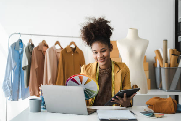 istock Fashion designers work in studios. 1571547482