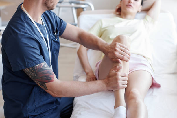 istock Massagist doing massage to patient 1571548572