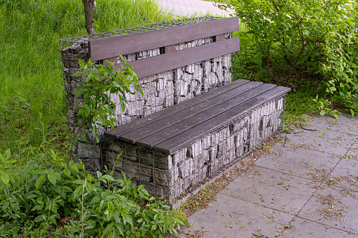 Gabion Stone Bench in Park, Outdoor City Architecture, Wooden Benches, Outdoor Chair, Urban Public Furniture, Empty Plank Seat, Comfortable Bench in Recreation Area