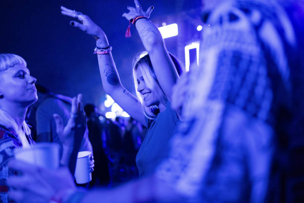 istock Dancing on music festival by night! 1571589875