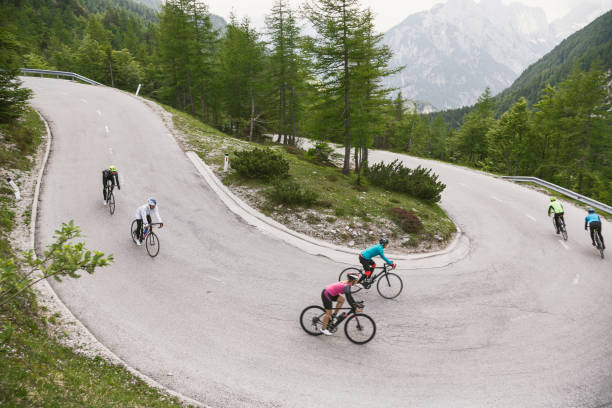 istock Group of cyclists on a hairpin curve 1571590777