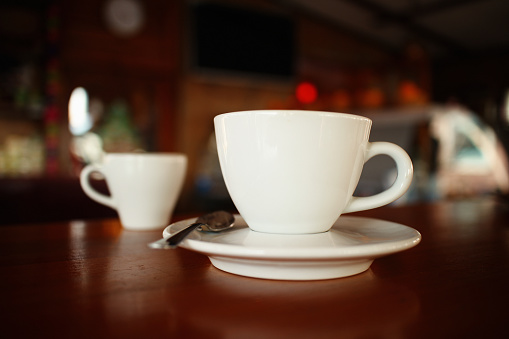 Coffee cups on table at cafe