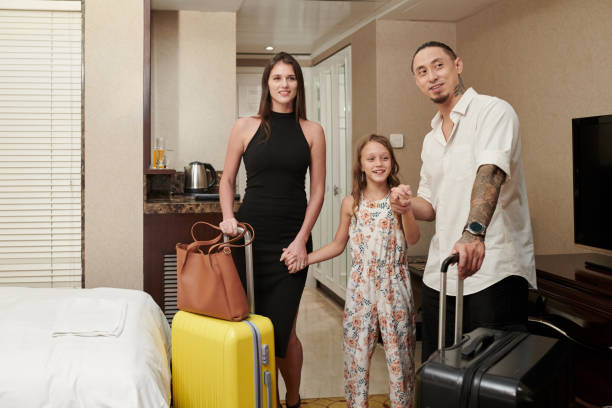 istock Family In Hotel Room 1571598551