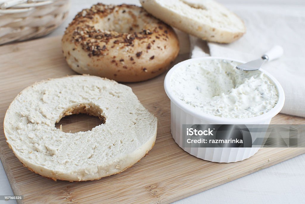 Bagels with cream cheese Bagels with poppy and seed on top with cream cheese American Culture Stock Photo