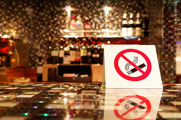 Photo of NO SMOKING sign on the bar.