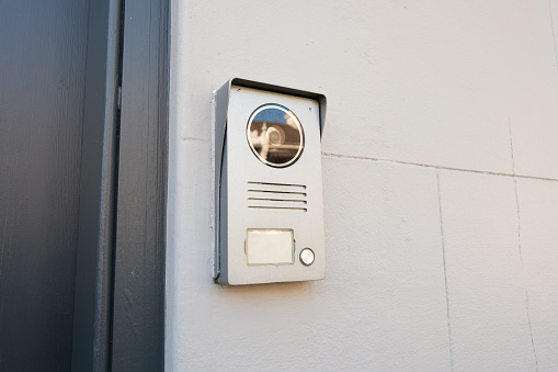 Security system on a wall next to a door.