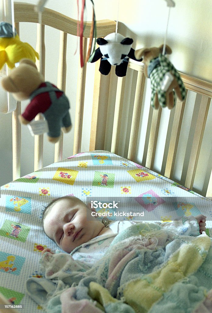 Baby boy asleep in his crib  Baby - Human Age Stock Photo