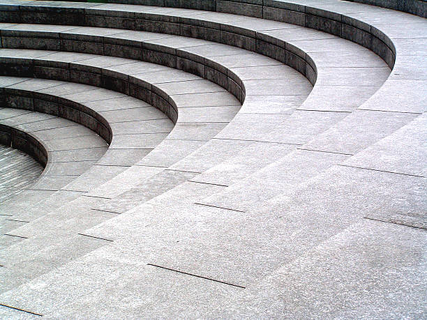 グレイストーン、御影石の曲線のステップの背景テクスチャ - amphitheater ストックフォトと画像
