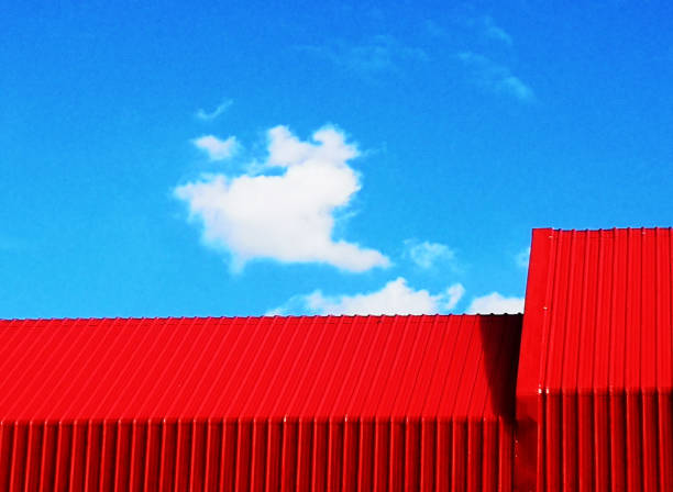 istock the red roof and blue sky backgrounds 1571631497