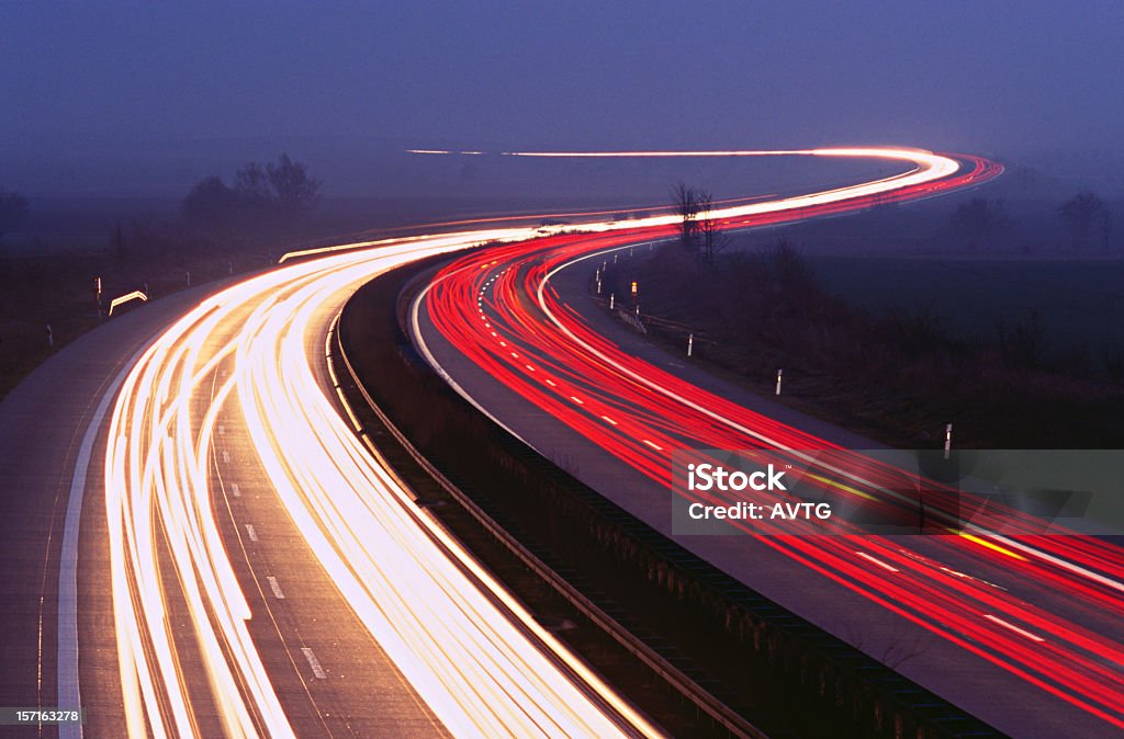 Nightride II Motorway, traffic at nightfall Headlight Stock Photo