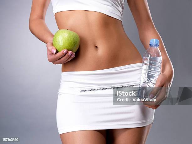 Healthy Female Body With Apple And Water Stock Photo - Download Image Now - Adult, Adults Only, Apple - Fruit