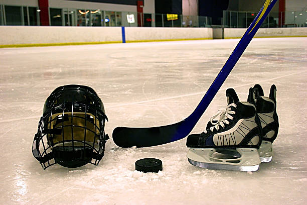 istock Hockey equipment displayed on ice in rink 157163727