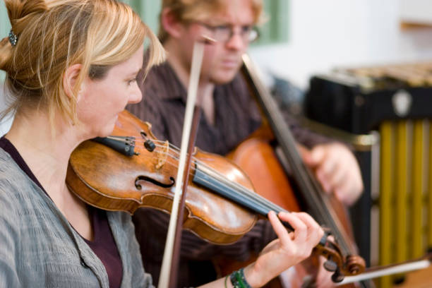 istock String duet of violin and cello in candid rehearsal 157163763