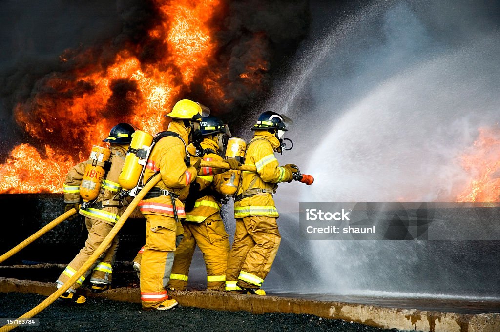 Fire Fighting Fire Fighters battle a blaze. Firefighter Stock Photo