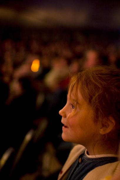 Amazed girl in the audience stock photo