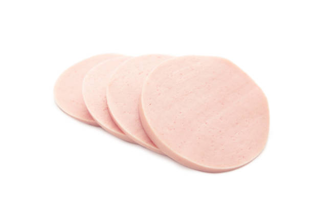 istock Sliced boiled tasty sausage isolated on white background 1571637925