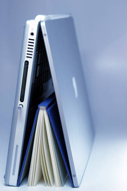 istock Real book standing under a laptop tent 157163851
