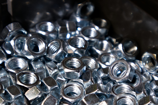 pile of steel nuts and bolts