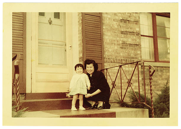 vintage photo of asian mother and toddler - asya fotoğraflar stok fotoğraflar ve resimler