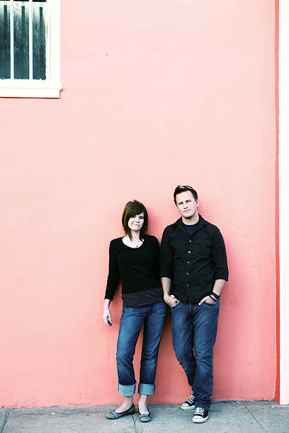 istock Boyfriend and Girlfriend Against a Pink Wall 157165270