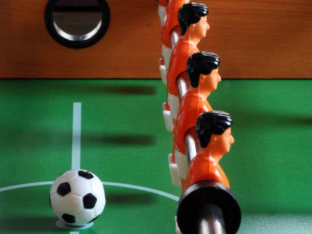 istock Foosball players facing away from the ball symbolizing disobedience 157165455