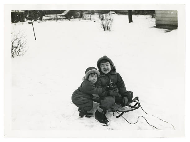 istock Two Asian Children Playing in the Snow 157165471