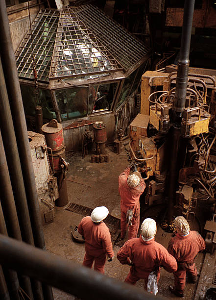 istock men working on the drill floor of an oil rig 157165490