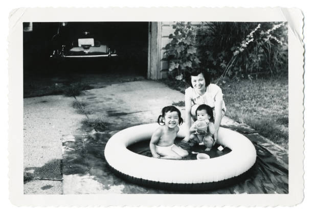 Young Mother with her Two Children stock photo