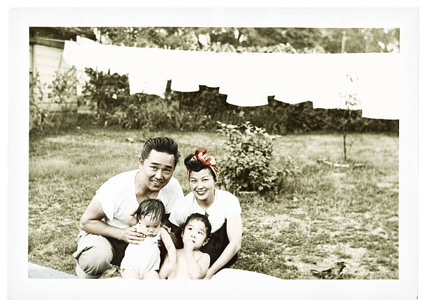 istock Young Asian Couple with Their Small Children 157165636