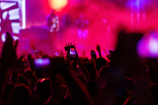 Crowd point of view inside a concert hall.