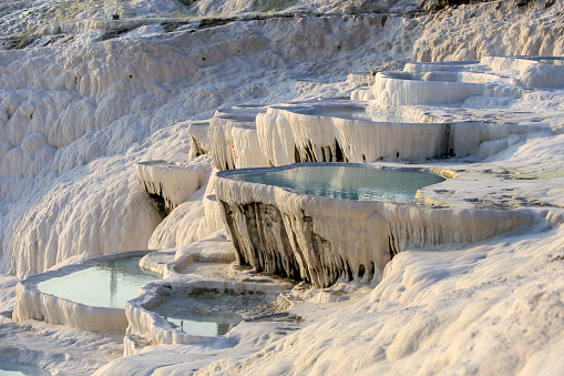White travertine limestone rock formations known as the cotton castle, Pamukkale, Denizli, Anatolia, Turkey, Asia Minor, Asia
