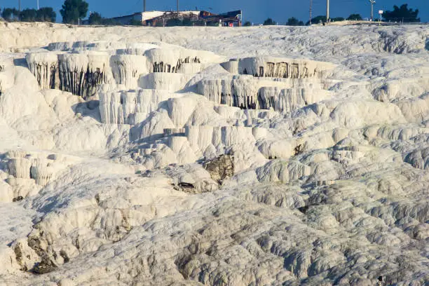 Photo of White travertine limestone rock formations known as the cotton castle, Pamukkale, Denizli, Anatolia, Turkey, Asia Minor, Asia