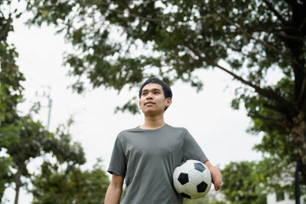 istock Handicapped man exercise at a public park. 1571680351