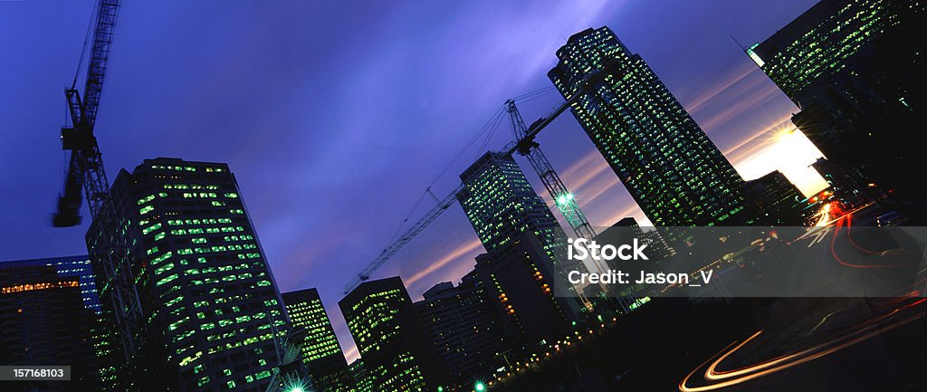Blurred Tower Cranes and Traffic  Apartment Stock Photo