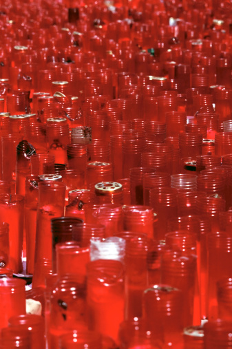 Red catholic memorial candles - at the memorial to those killed at Atocha railway station, Madrid - March 11th 2004.