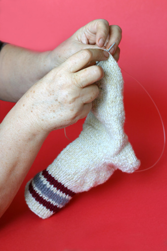 hands knitting a sock