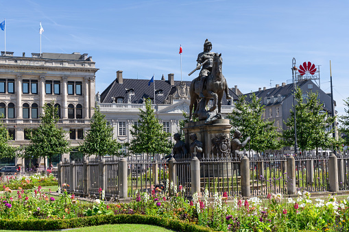 The Jan Breydel and Pieter de Coninck statue located in the historical city center and Market Square (Markt) in Bruges (Brugge), with beautiful nice cloud blue sky Belgium on a sunny day