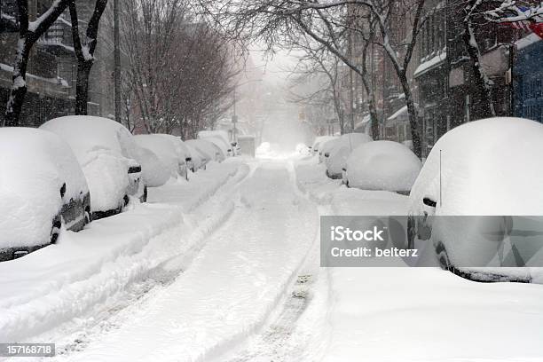 Looking Down A Road Full Of Snow Covered Cars Stock Photo - Download Image Now - Blizzard, Snow, Winter