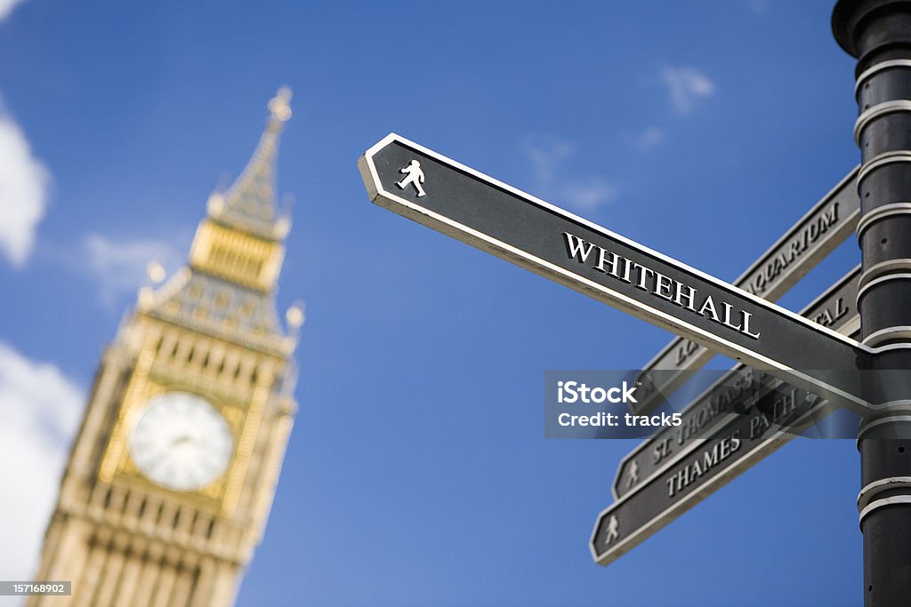 London sign directing towards Whitehall with Big Ben in background  Whitehall - London Stock Photo