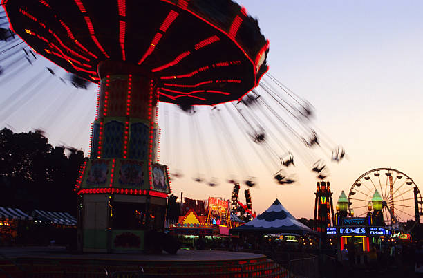 istock A swing carrousel entertaining ride at the fair 157169093