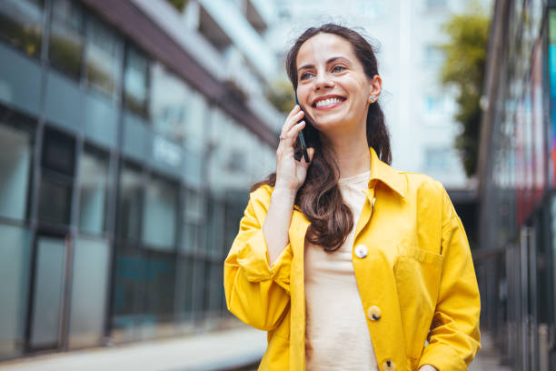 istock Woman talking on phone outdoor. 1571691151
